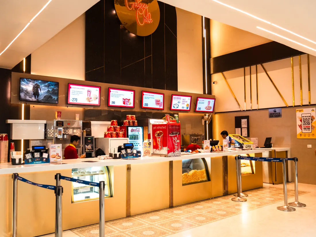 The Galaxy Cinema cafe counter with menu screens